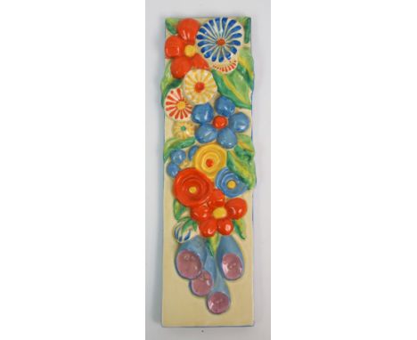 A CLARICE CLIFF BIZARRE WALL PLAQUE  of rectangular form with moulded and colourful painted flowers 43cm x 12.5cm   Condition
