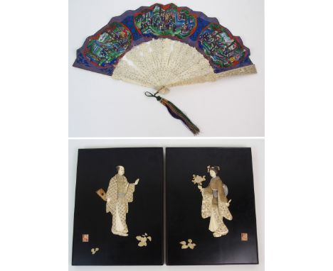 A PAIR OF LACQUERED AND ONLAID PANELS decorated in ivory and abalone shell with male and female figure (losses), signed, 30.5