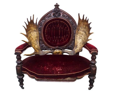 AN UNUSUAL VICTORIAN MAHOGANY BARONIAL THRONE armchair with floral knop above grape and scrolling foliate arched back with re