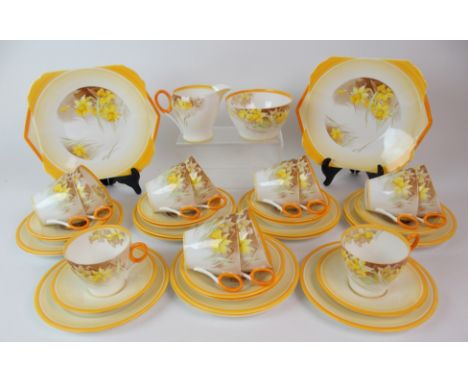 A SHELLEY PORCELAIN TEASET transfer printed and overpainted with Daffodils, pattern number C12571, comprising two cake plates