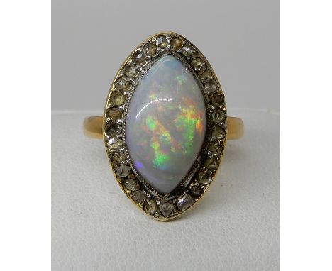 AN 18CT GOLD OPAL AND ROSE CUT DIAMOND RING all gems in closed back settings to the marquis shape, finger size O1/2, weight 3