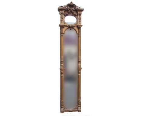 AN EMPIRE STYLE GILTWOOD HALL MIRROR with carved plinth scroll above egg and dart moulding, berried laurel swag enclosing an 