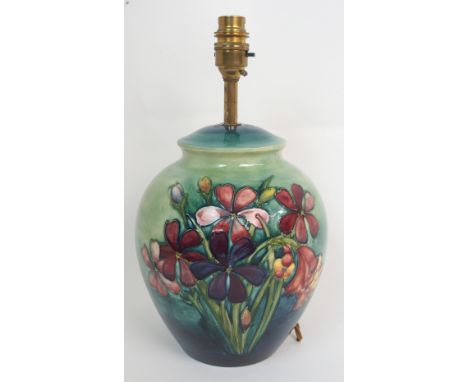 A MOORCROFT SPRING FLOWERS LAMP BASE of tapering baluster form, partial paper label to base, 32.5cm high Condition Report: Ne