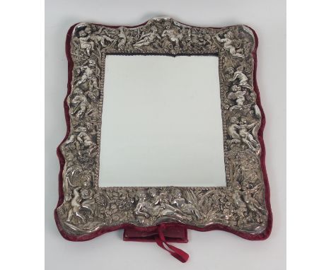 A MODERN STERLING SILVER MOUNTED EASEL MIRROR of rectangular shape, cast in relief with winged putti amid foliage, with maroo