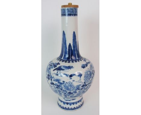 A CHINESE BLUE AND WHITE BALUSTER VASE painted with birds and butterflies amongst peonies beneath a stiff leaf band and key p