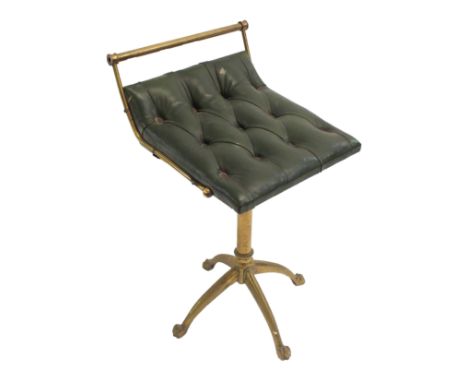 A VICTORIAN BRASS AND LEATHER BUTTON SEAT PIANO STOOL the swivel seat on four arched legs with claw feet, 62cm high Condition