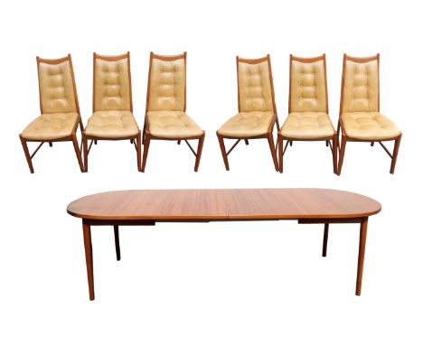 A MID-CENTURY TEAK EXTENDING DINING TABLE 73cm high x 265cm wide (fully extended) with two extra leaves and six teak dining c