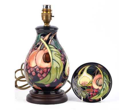 Emma Bossons FRSA (British, b.1976) for Moorcroft ovoid lamp (shape L7/7) in Queens Choice design with wood base, blue felt t