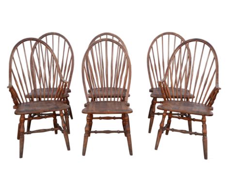 Slovenian Design, six spindle back chairs, in the manner of Ercol, to include two armchairs, stamped to the seats, the armcha