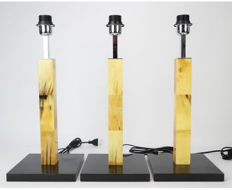 Arca, three square column lamps, lacquered finish, black lacquer base, chromed metal, continental fittings, the lamp base and