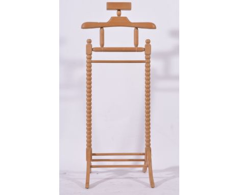 Beechwood valet stand, bobbin turned uprights, height 120cm and a standard lamp, (2).