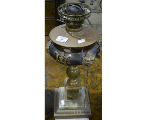 Pottery baluster shape oil lamp, Slaters style, with floral decoration, 48cm and an oxidised metal urn shape lamp base, an al