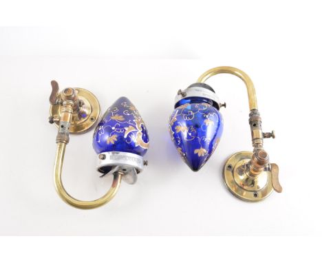 Pair of brass wall fitting lamps, blue glass shades, decorated in gilt and white enamel, formerly gas powered, and another vi