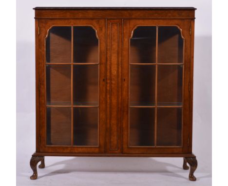 Walnut china cabinet, with two six pane glazed panel doors, short cabriole legs, width 107cm.