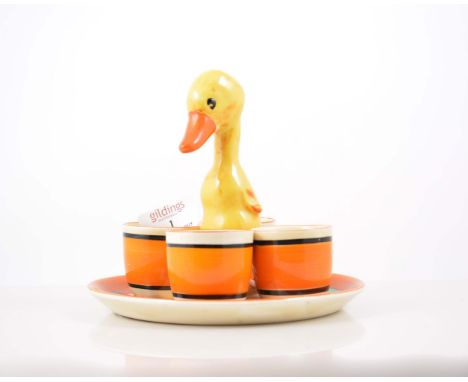 Clarice Cliff novelty nursery egg cruet, stand painted in 'Autumn (Balloon Trees)' design, centered with a duckling, diameter
