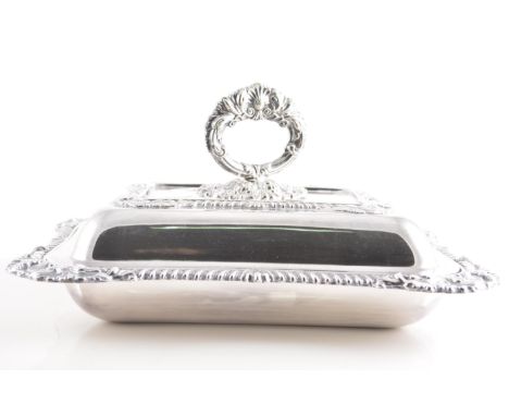 Electroplated rectangular entree dish, foliate and gadrooned outlines, width 31cm and a plated five light candelabra, (2).