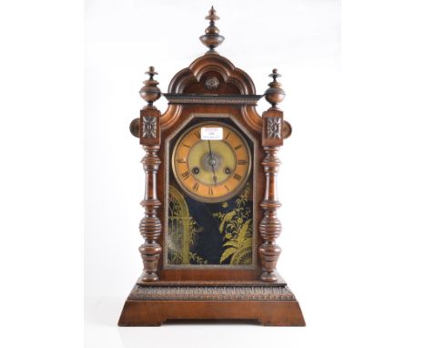 American stained wood shelf clock, with split spindles, simulated mercury pendulum, 54cm.