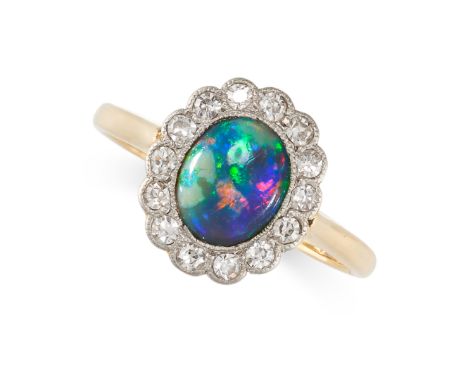 NO RESERVE -&nbsp;AN ANTIQUE BLACK OPAL AND DIAMOND CLUSTER RING in 18ct yellow gold and platinum, set with an oval cabochon 