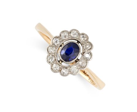 NO RESERVE -&nbsp;A SAPPHIRE AND DIAMOND CLUSTER RING, EARLY 20TH CENTURY in 18ct yellow gold and platinum, set with an oval 