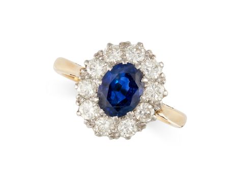 NO RESERVE -&nbsp;A VINTAGE SAPPHIRE AND DIAMOND DRESS RING in 18ct yellow gold and platinum, set with an oval cut blue sapph