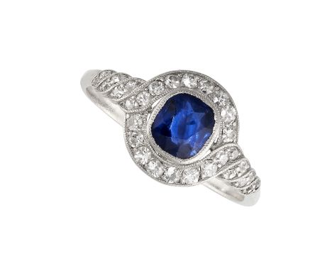 NO RESERVE -&nbsp;A SAPPHIRE AND DIAMOND DRESS RING in 18ct white gold, set with a cushion cut blue sapphire of 1.04 carats, 