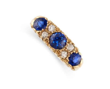 NO RESERVE -&nbsp;A SAPPHIRE AND DIAMOND DRESS RING in 18ct yellow gold, set with a trio of graduated round cut blue sapphire