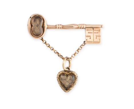 NO RESERVE -&nbsp;AN ANTIQUE HAIRWORK MOURNING LOCKET BROOCH  in yellow gold, designed as a key, the handle with a glass cove