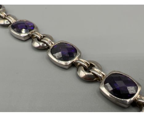 Ladies silver amethyst bracelet. Comprising of six amethyst stones set in rub over setting. 33.4g