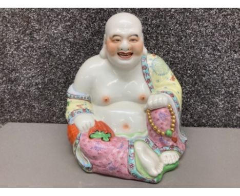 A ceramic laughing Buddha 25cm high