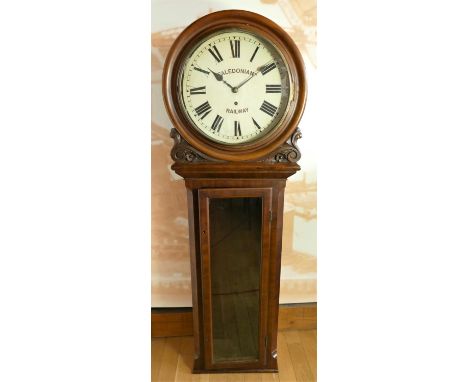 A Scottish mahogany station clock, the 14" white dial painted Caledonian Railway, with Roman numerals, the trunk with canted 