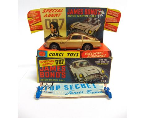 A CORGI NO.261, JAMES BOND ASTON MARTIN D.B.5  gold, excellent condition (all features working), complete with two assassin f