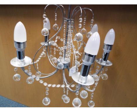 A modern good quality chrome five arm chandelier with glass detailing Est £20 - £40