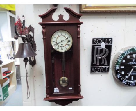 A Hermle wall clock with Westminster chime and pendulum This lot MUST be paid for and collected, or delivery arranged, no lat