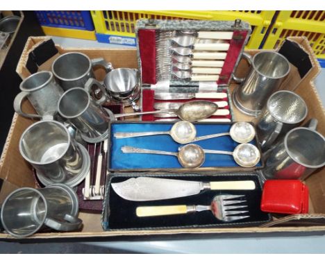 A good mixed lot to include a collection of plated flatware, pewter tankards to include Walker and Hall, a Swiza 7-jewel alar