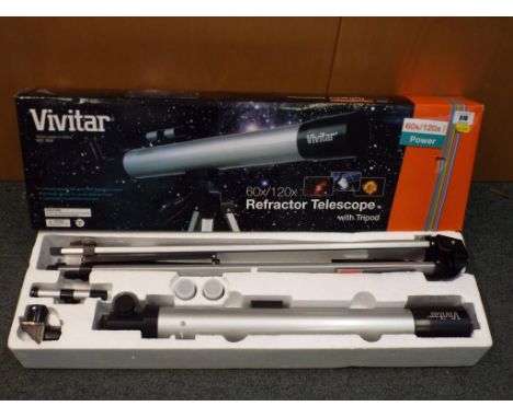 A Vivitar 6x/120 refractor telescope with tripod