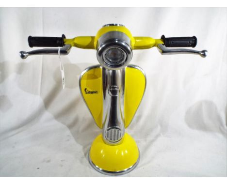A novelty cast iron Vespa scooter lamp approximately 42 cm (h) x 42 (w).
