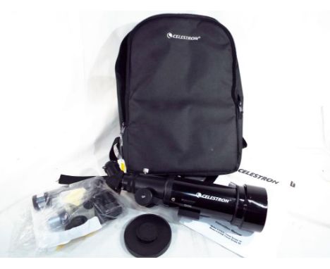 A Celestron travel scope 70, model No.21035 with instruction manual and travel bag