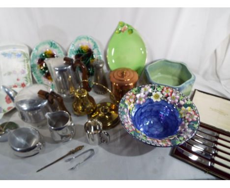 A good mixed lot to include a white metal tea and coffee set by Picquot Ware and other ornamental metalware,and a quantity of