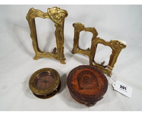 A set of three brass graduated photo frames in the style of art nouveau and a compass with leather protective case (qty)