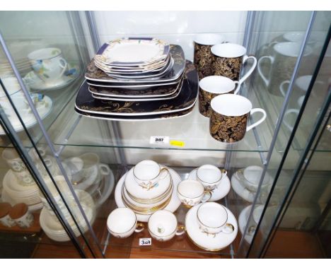 Two shelves containing a quantity of ceramic tableware to include 20 pieces of Royal Stafford Merlin ware decorated in the Pe