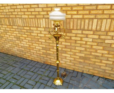 A good solid brass standard lamp with barley-twist and scrollwork decoration dated 1931 - Est £20 - £40