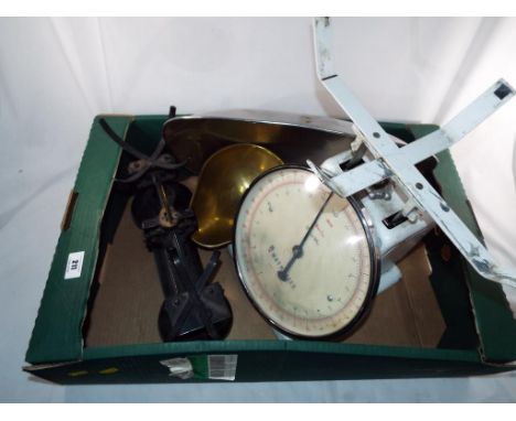 A cast iron weighing balance by Libra Scale Company and a Weighmaster weighing balance