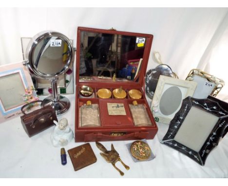 A good mixed lot to include a vintage vanity travel case with powder pots, a collection of good quality photo frames, a bathr