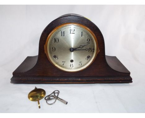 An oak cased mantel clock, Arabic numerals on a silvered dial, Westminster chimes, the movement marked 'Anvil', serial no 106