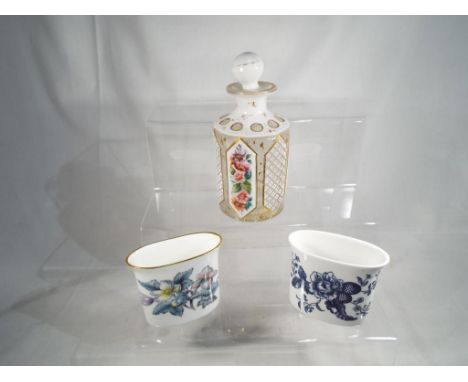 A late 19th / early 20th century glass stoppered perfume bottle with hand-painted floral decoration within gilded panels, 13 