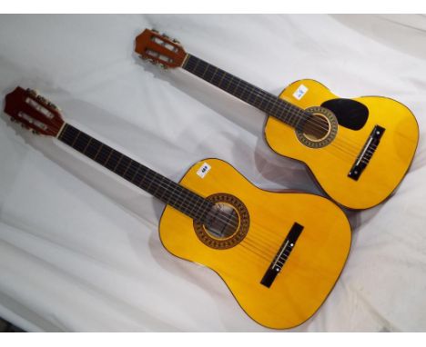 Two practice acoustic guitars, one with internal paper label marked Herald model No. HL34 by The John Hornby Skewes & Co Ltd 
