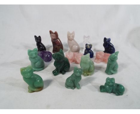 A collection of approximately sixteen hard stone  carved cats to include jade, lapis lazuli and similar (qty)