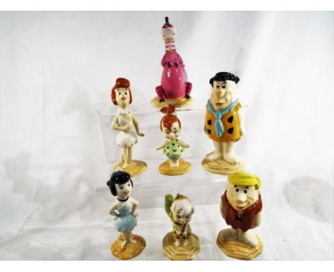 Beswick - a set of 7 Beswick Flintstone ceramic figurines. Estimate £150 - £200