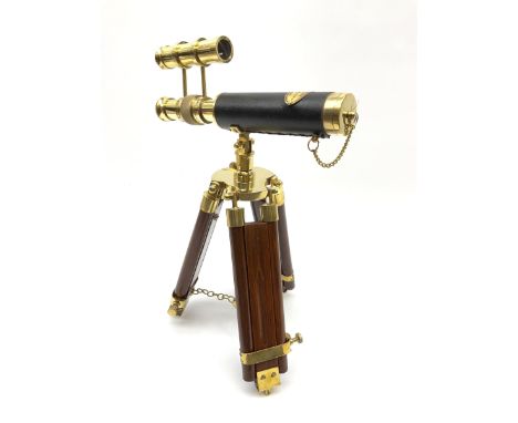 Reproduction telescope on tripod stand, plaque to the top reading 'Victorian Marine Telescope London 1915', H34cm