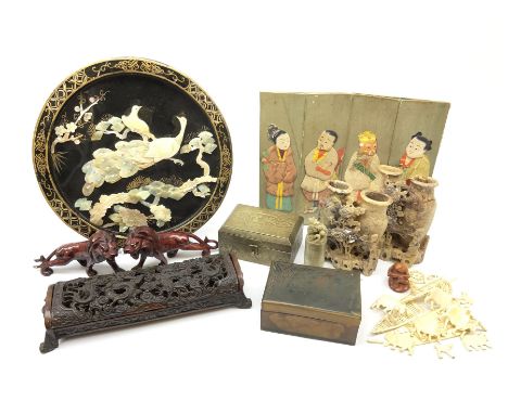A group of assorted Oriental collectables, to include pair of carved soapstone bud vases, papier mache plaque of circular for